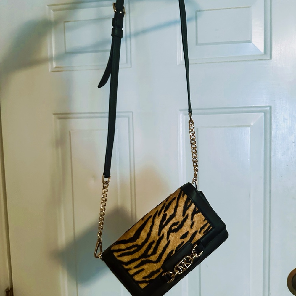 Clutch wristlet purse holds card holders on inside as well. It’s semi new!